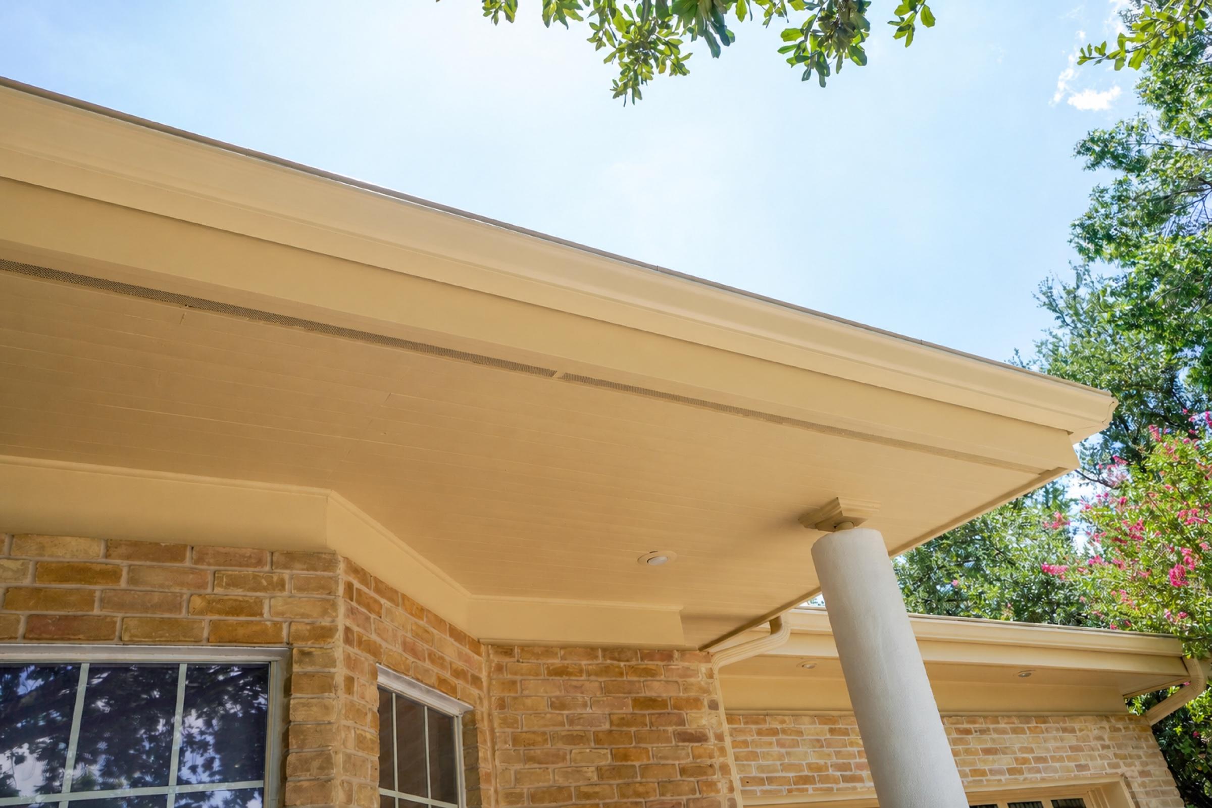 Long front eave after repair, preparation, and painting