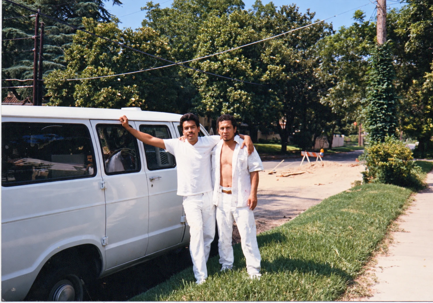 An early photograph of Michael and a fellow painter beside their work van